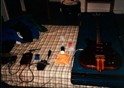  a bassist's hotel room.